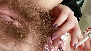 Smoking in my car and showing my hairy pussy in skirt